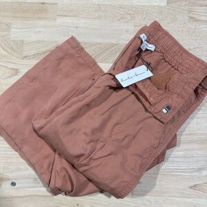 Rose colored cargo pants with tag. Never worn.